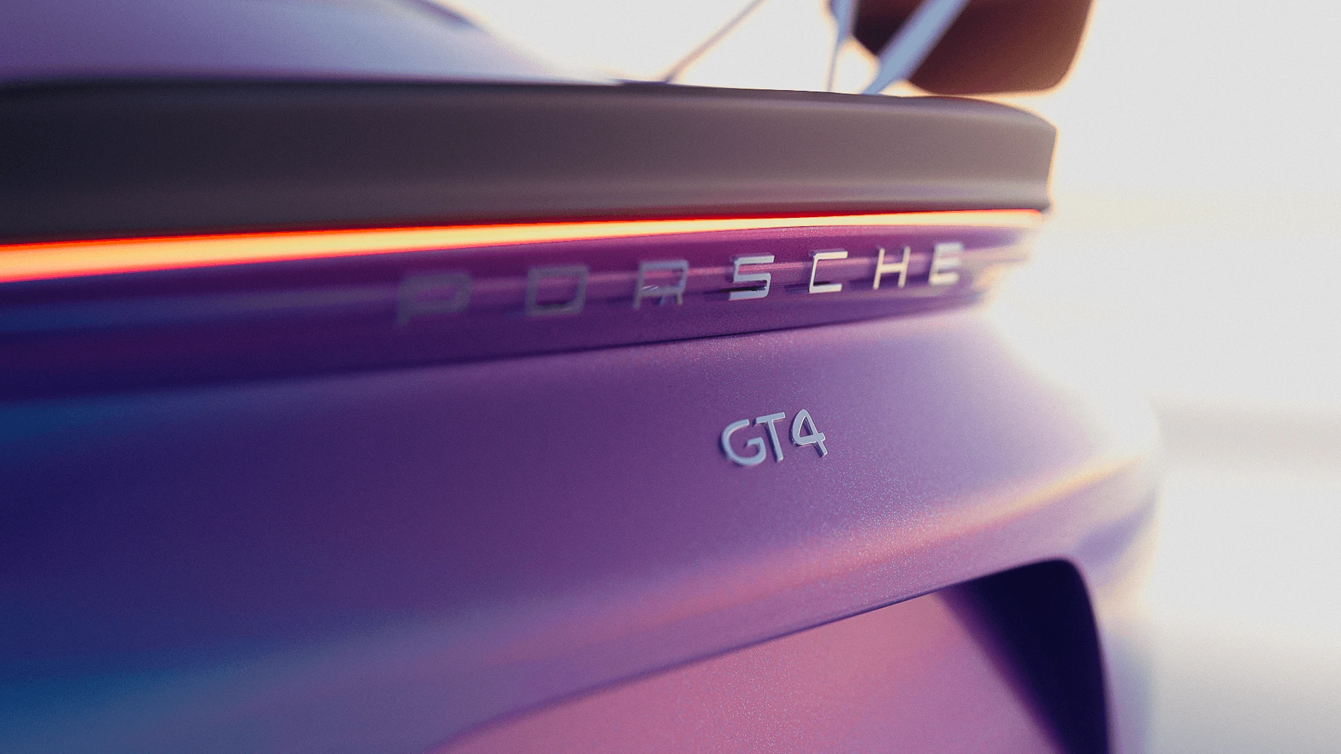Bright rear badge detail of the Porsche GT4 with violet and cyan color gradients