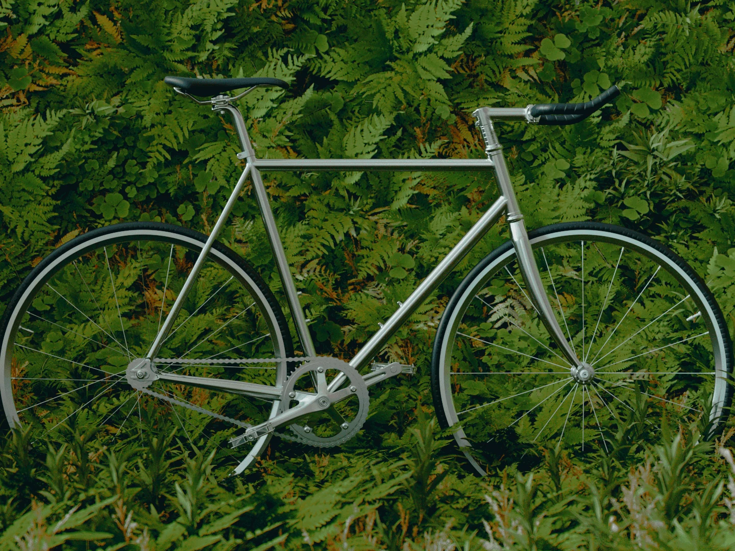 Silver single-speed bicycle surrounded by dense green foliage